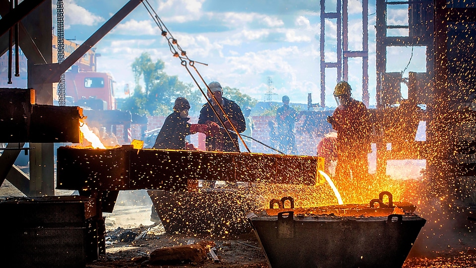 Men working in the steel yard