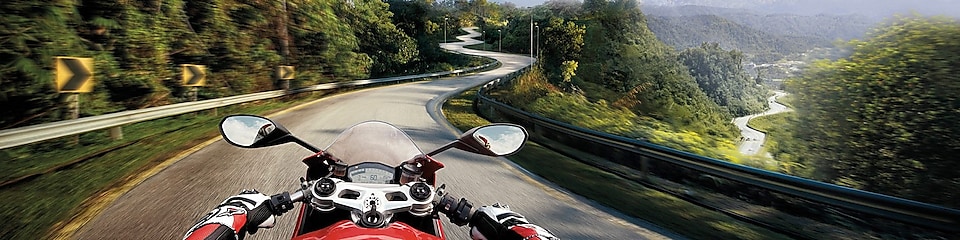 rider view of motorbike driving on mountain road