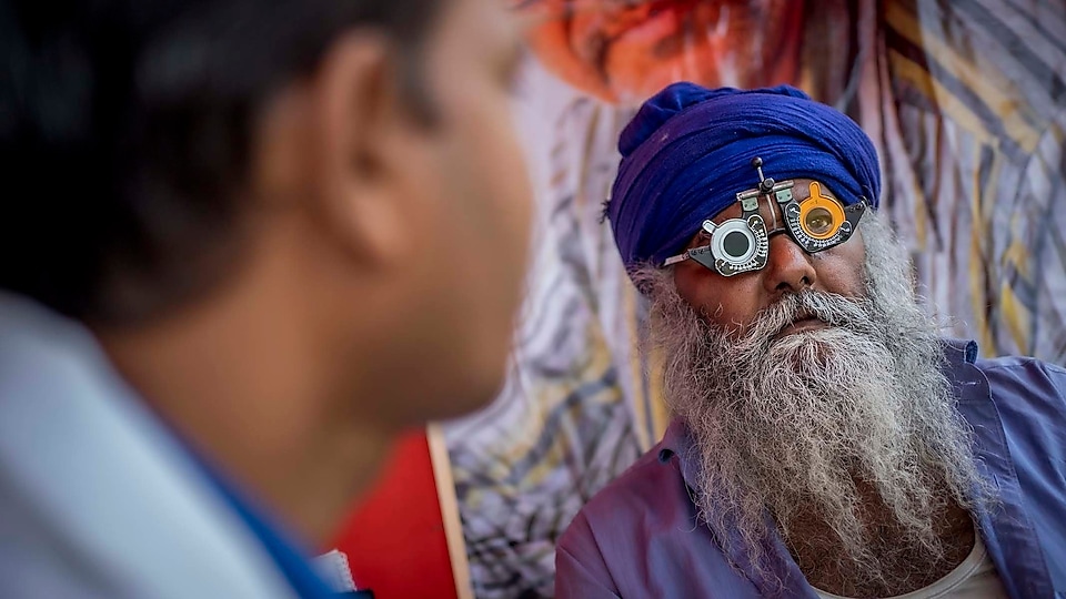 Nirmal Singh getting his eyes checked