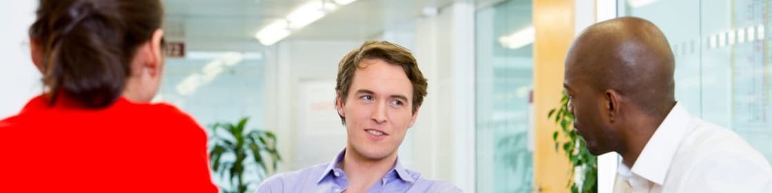 two employees interviewing a potential candidate