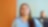 An Indian woman in a blue shirt smiles while looking up, with pecten energy lines overlay. Another person is in the blurred background.