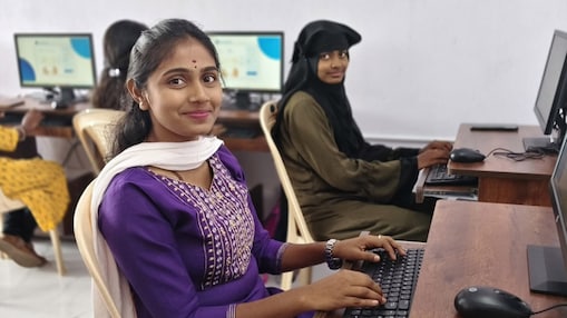 Two students from the fenceline community participating in a digital skills session at a Shell-supported Skills Centre.