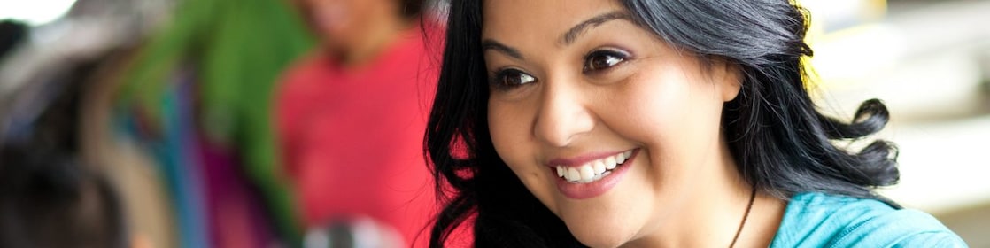 Young woman greating customer at a donation center