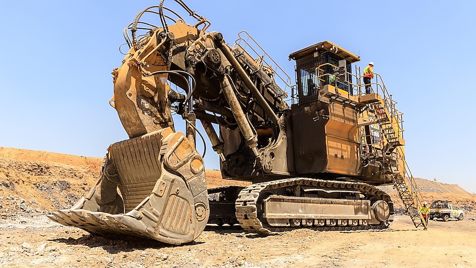 Mining industry excavator and workers