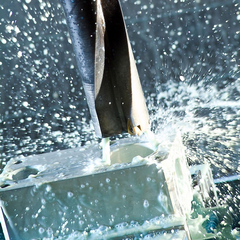 An image of a splash of water against a machine