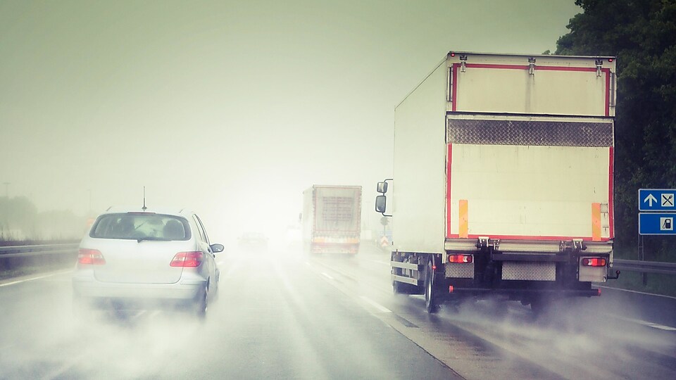 Vehicles driving on the motorway during heavy rain