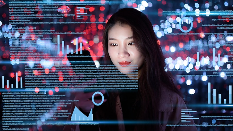 Girl on her tablet, surrounded by hologram data charts