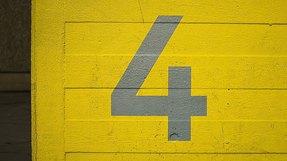Number 4 on a yellow door