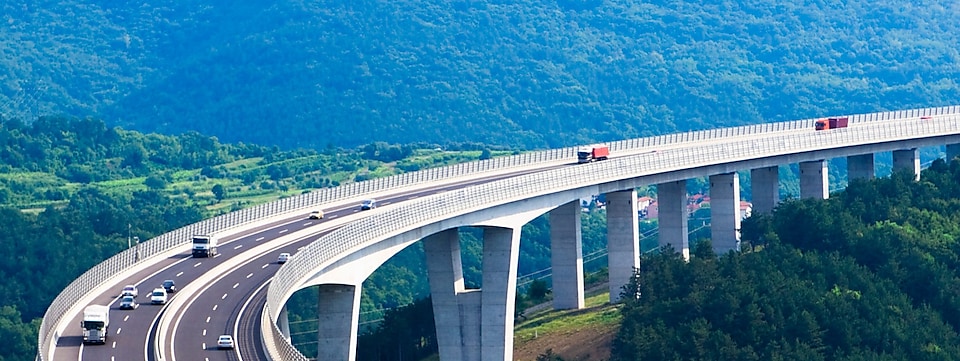 Vehicles traveling across elevated road bridge