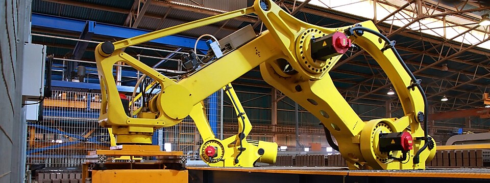 Robotic arm in operation at a manufacturing plant