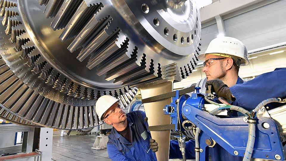 Workers inspecting a turbine