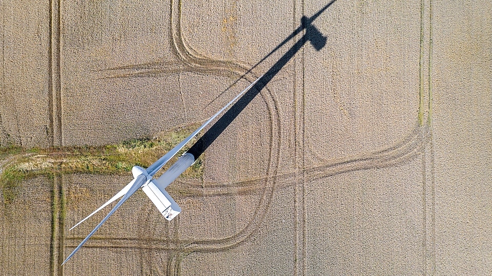 Aerial view of wind turbine on farmland
