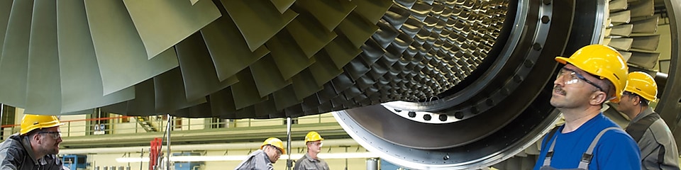 Engineers inspecting turbine