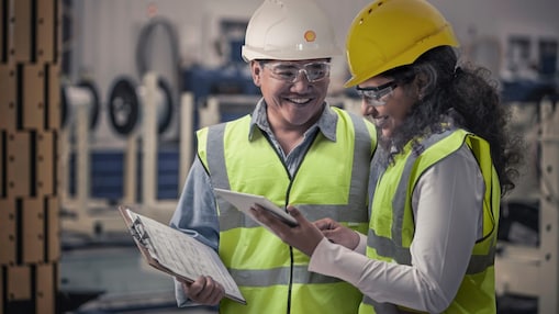 Shell worker consulting an industry worker on site