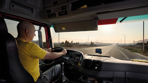 truck driver driving on empty road