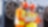 2 builders in hardhats staring at a laptop