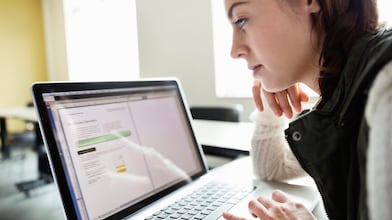 Woman looking at the laptop screen