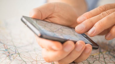 man looks at map