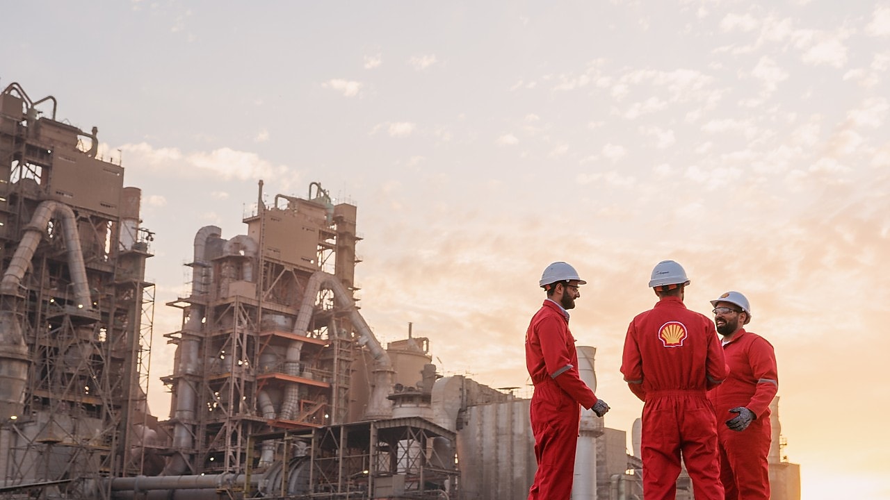 three men discussing