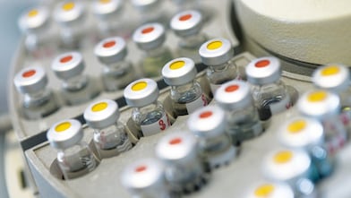 Vials of samples on an auto sampler