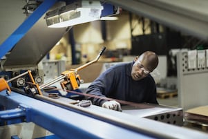 A Shell expert precisely draws a line before using machinery.