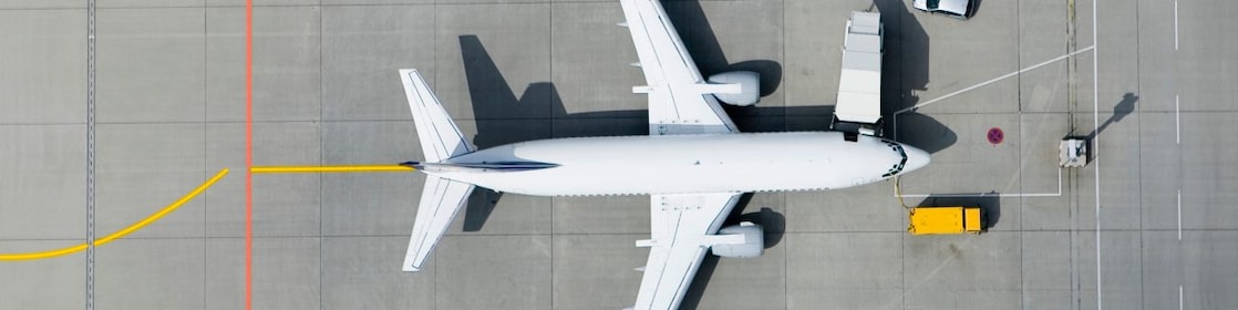 Aerial view of airplane and vans