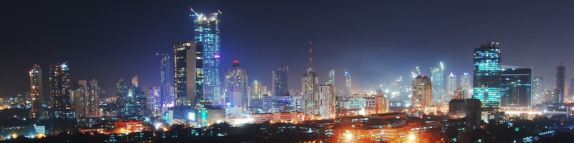 Cityscape with lights and energy in use in the city of Mumbai, India at night.