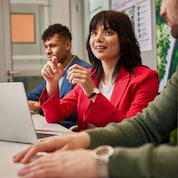 Eurasian female employee leading a team discussion