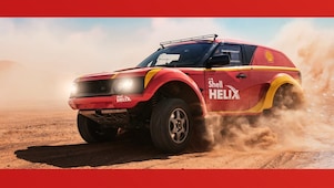 Sebastian Vettel and Kimi Raikkonen fill up Ferrari cars at a Shell station