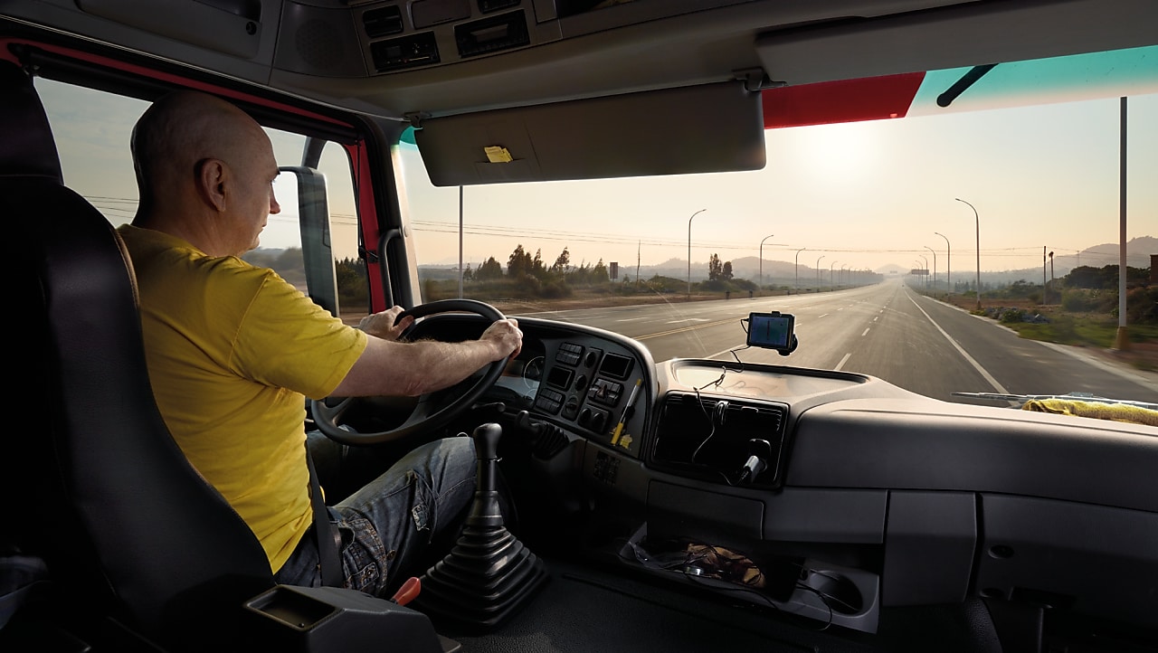 truck driver driving on empty road