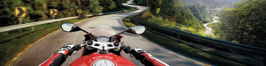 rider view of motorbike driving on mountain road