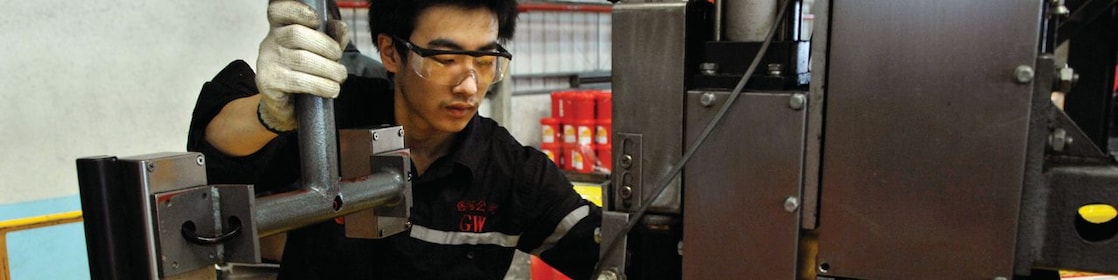 Man filling oil in drum
