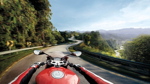 rider view of motorbike driving on mountain road