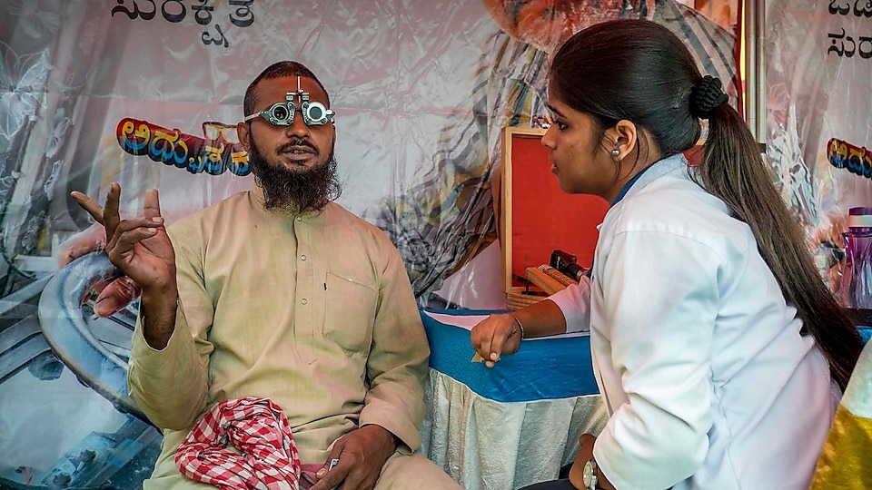 Aslam Malik, who has been driving a truck for 20 years, gets his vision checked at Bangalore